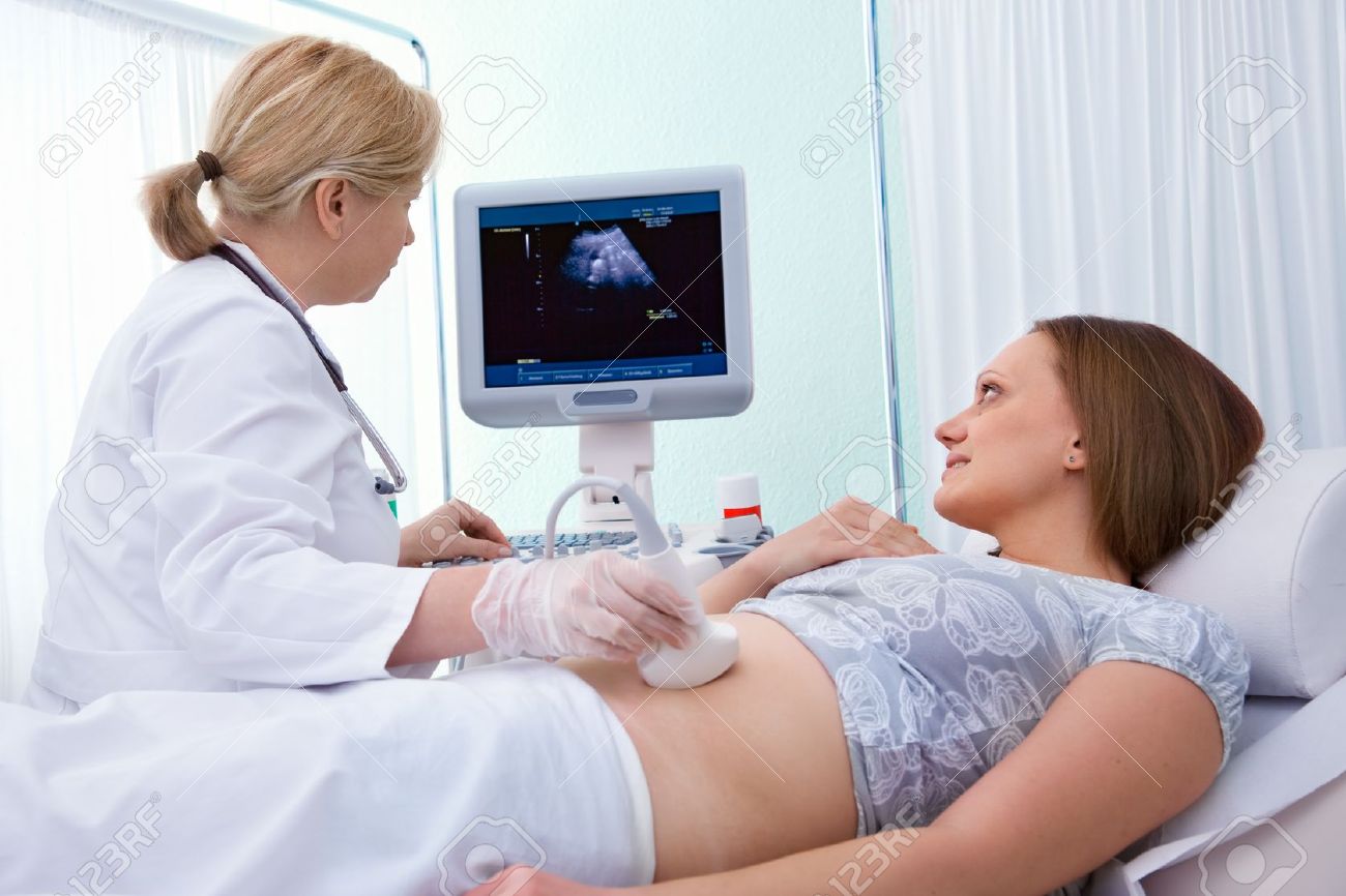 10289594 Pregnant woman getting ultrasound from doctor Stock Photo 10289594 Pregnant woman getting ultrasound from doctor Stock Photo